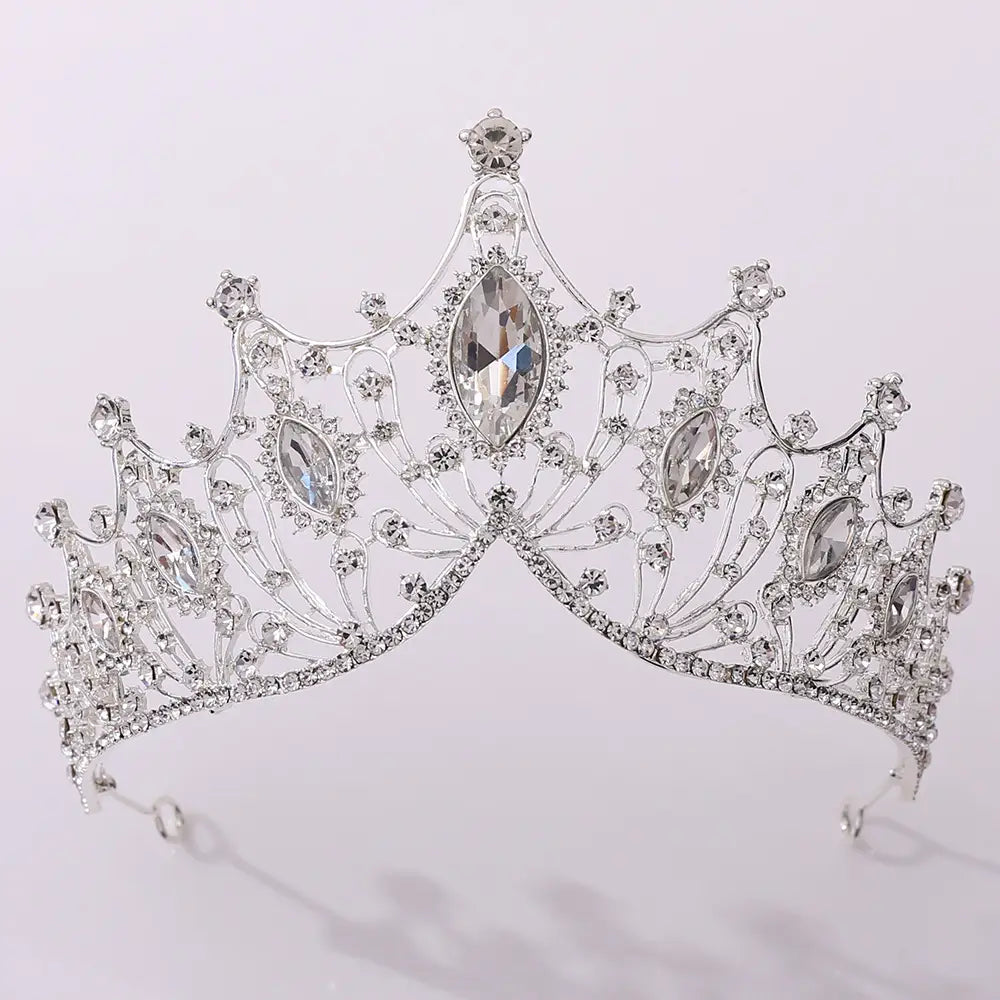 Classic vintage bridal tiara in silver adorned with sparkling clear crystals and larger marquise-cut stones for elegant bridal use.