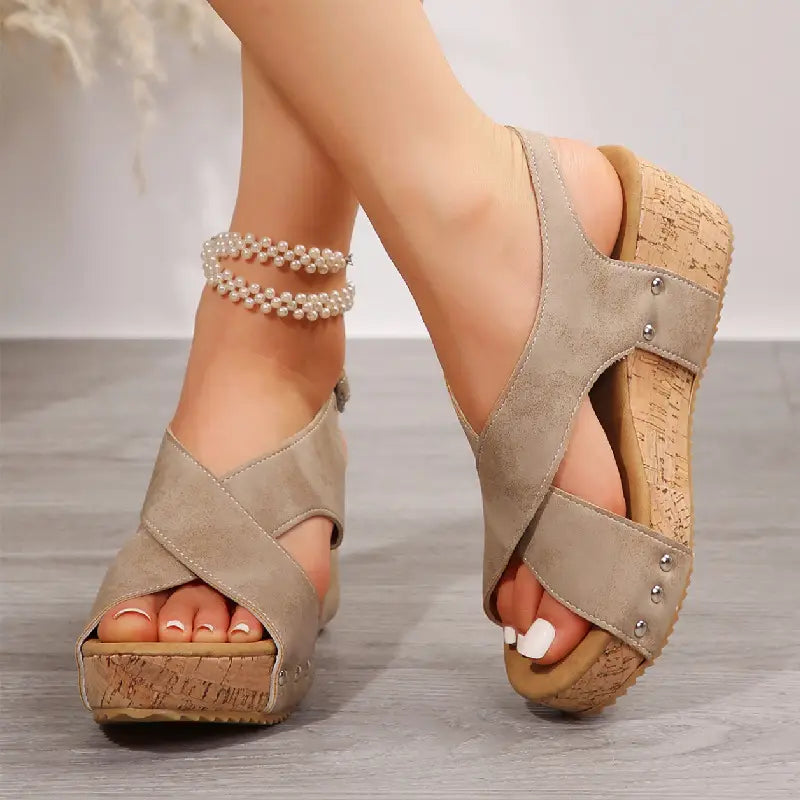 beige suede rivet wedges snadals with cork soles featuring silver studs and fish mouth design fish mouth shoes