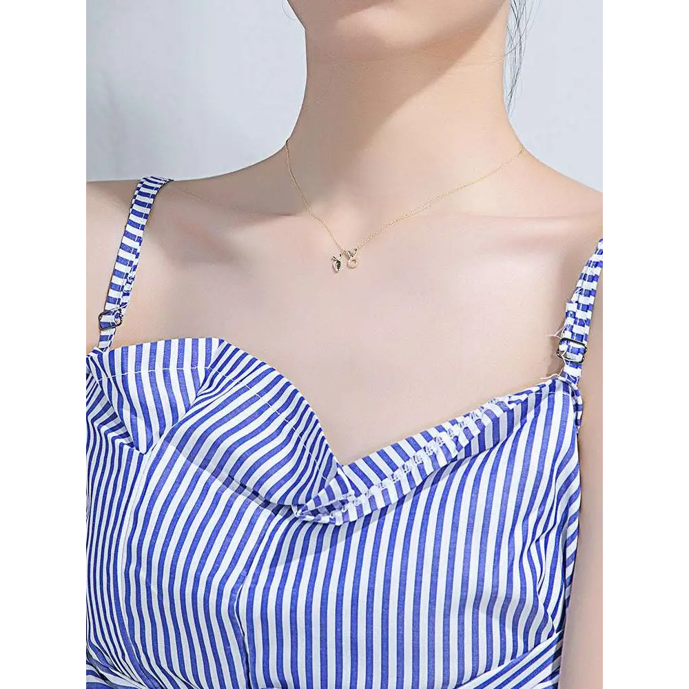 Delicate 18k gold plated rabbit pendant necklace with a small intricately designed pendant and two tiny charms