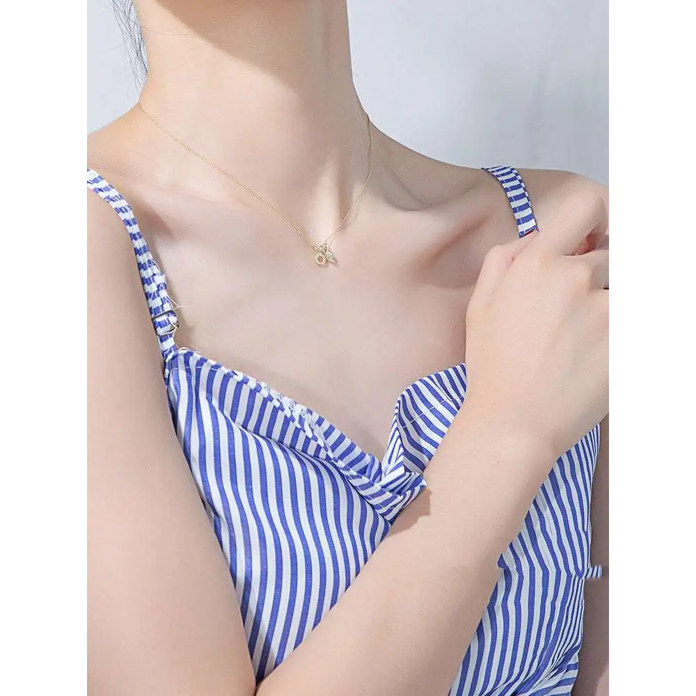 Delicate 18k gold plated necklace featuring an intricate bee pendant alongside a plated rabbit pendant necklace with carrot