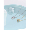 Two delicate rabbit pendant necklaces in 18k gold plated silver and gold with sparkling gemstone accents and carrot detail