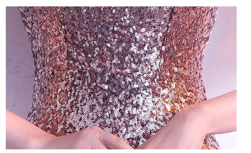 A shimmering rose gold and silver sequined corset top with a fitted form-fitting design ideal for long slim fit and slim fit fashion host gowns.