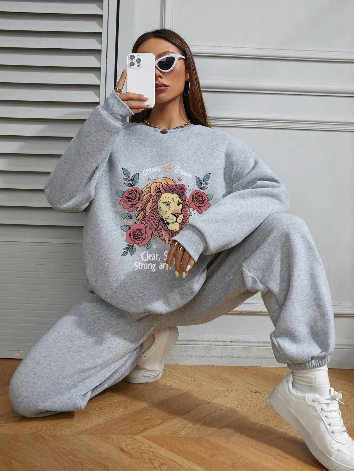 Gray oversized regular fit long sleeve sweatshirt featuring a lion and rose graphic design suitable for casual wear.