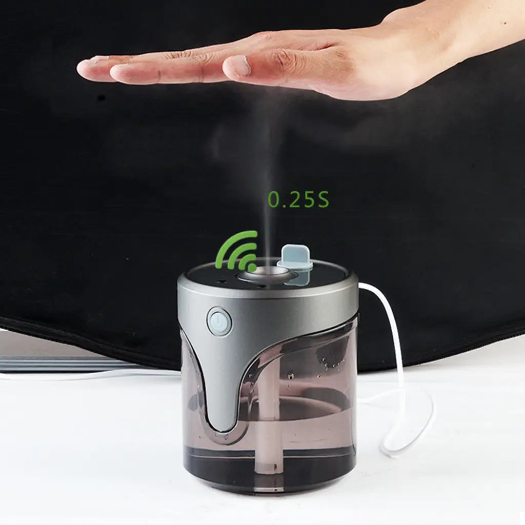 compact silver and transparent plastic auto alcohol dispenser handsanitzer with a sleek modern design and humidifier function