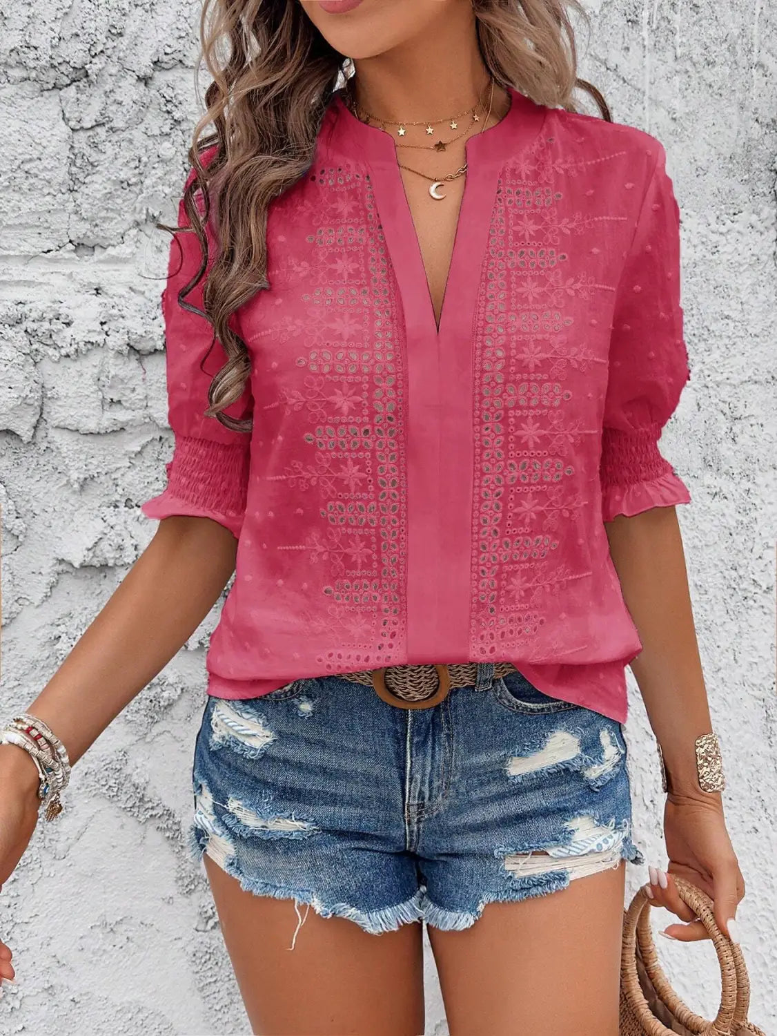 Pink embroidered blouse with three-quarter puff sleeves and a v-neckline featuring hollow hair ball detailing from the white eyelet puff sleeve hollow hair ball blouse collection.