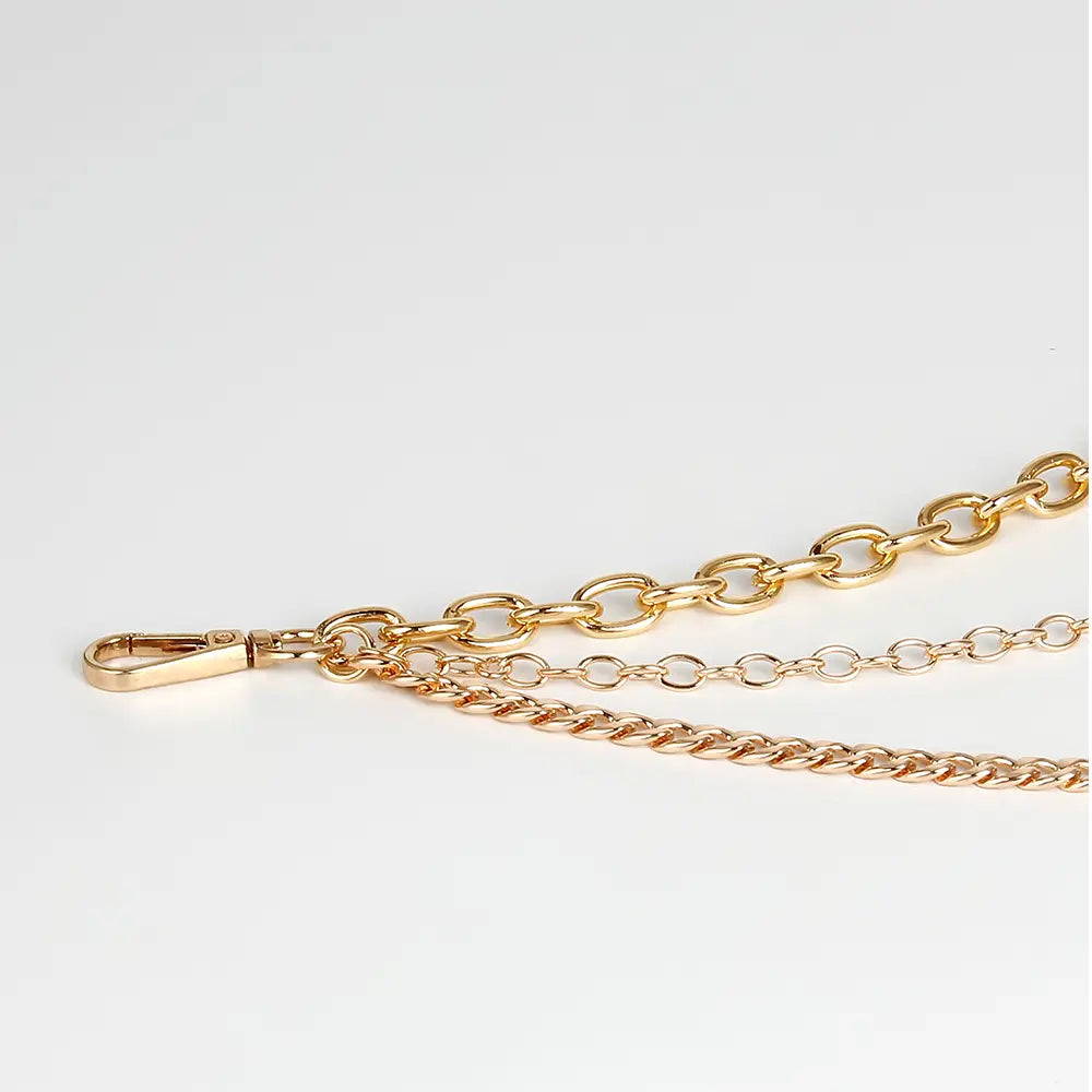 gold-toned silver chain belt featuring a combination of large oval links and smaller curb-style chains with a polished metal clasp designed as summer body jewelry and body jewelry hip accessory