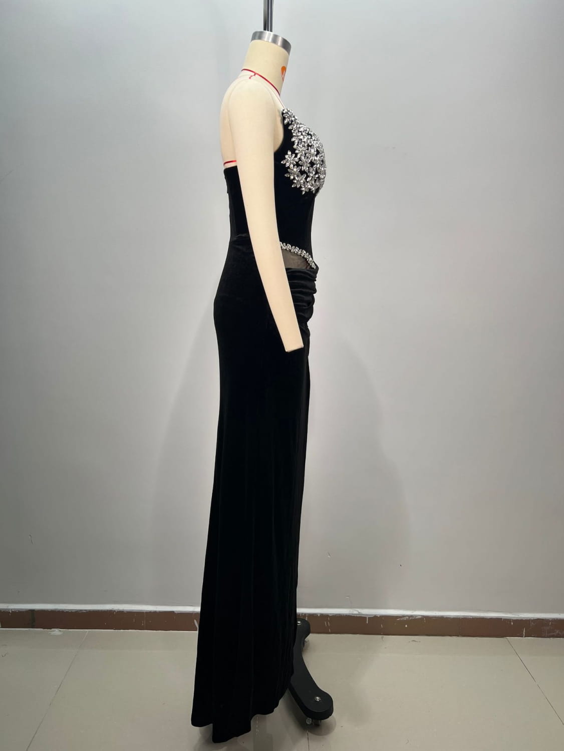 Black velvet black bandeau hot drilling long dress featuring a beaded floral embellishment across the bust and a sheer panel at the waist.