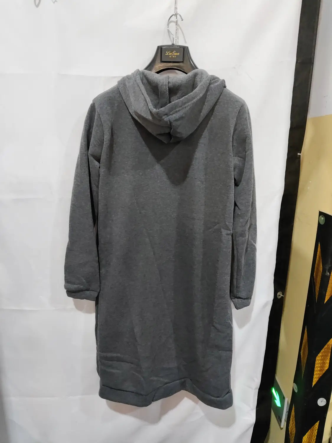 gray hooded sweatshirt dress with a soft relaxed fit ribbed cuffs thick fabric designed for winter wear in a women zip up long hooded sweater
