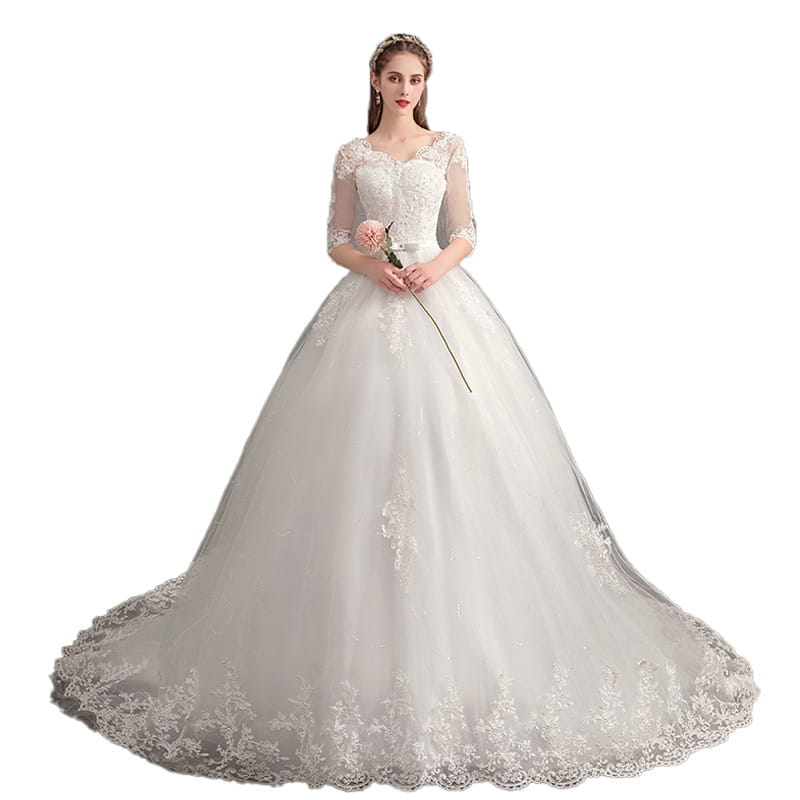 Elegant ivory high waist wedding dress trailing featuring intricate lace detailing on the bodice sleeves and hemline.
