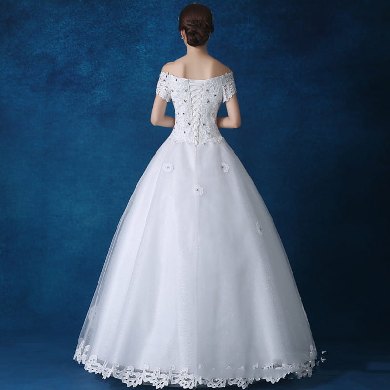 white off-the-shoulder wedding gown with lace detailing and beaded embellishments made from main fabric offered by qidi studio wholesale