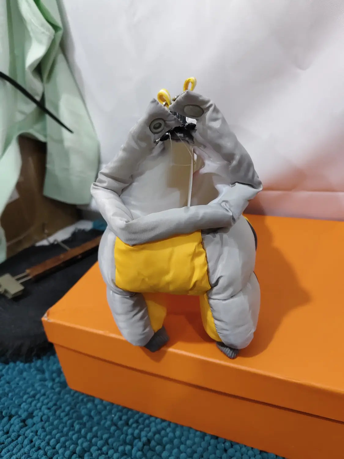 gray and yellow puffer-style plush pet dog winter clothes with a hooded design resembling an animal character for dog winter protection.