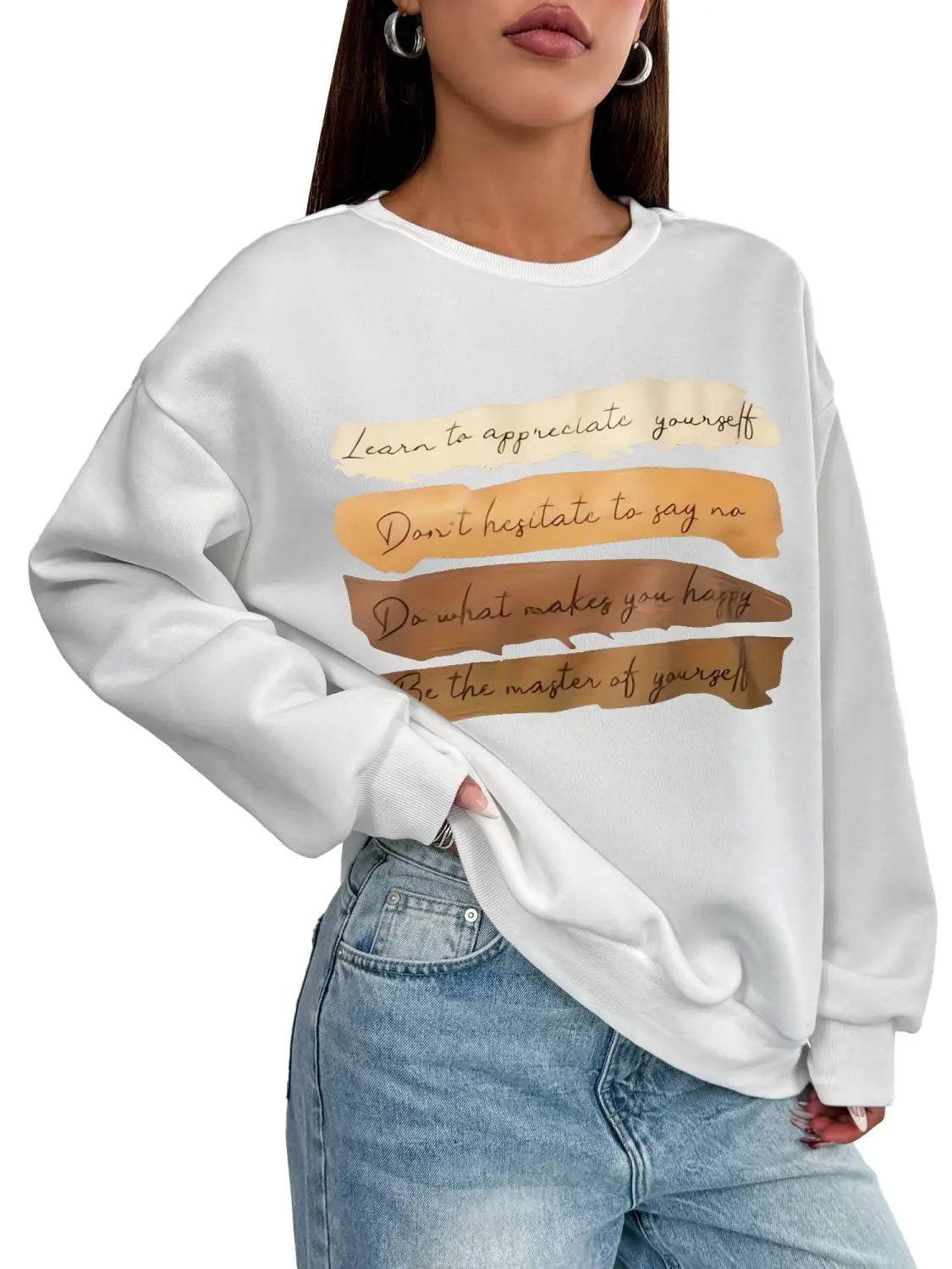 White oversized long sleeve sweatshirt featuring motivational quotes printed in brown and gold on horizontal stripes ideal for daily wear in a solid colour design.