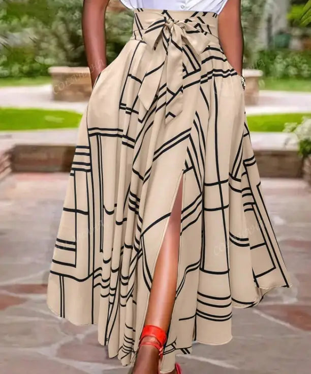 beige high-waisted midi skirt with black geometric pattern and tied waistband designed as a simple daily slit skirt for a solid color simple look