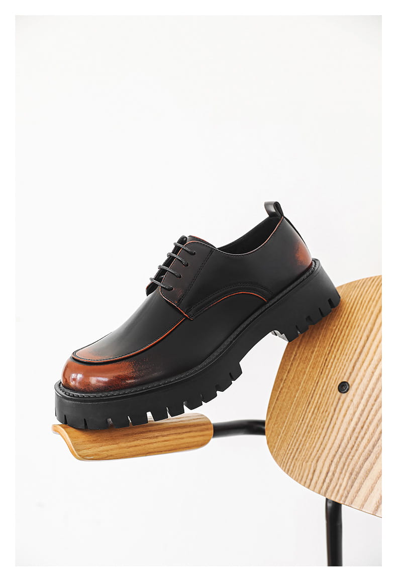 men’s casual leather shoes featuring black and brown leather with red stitching and a chunky platform sole in a lace-up oxford style