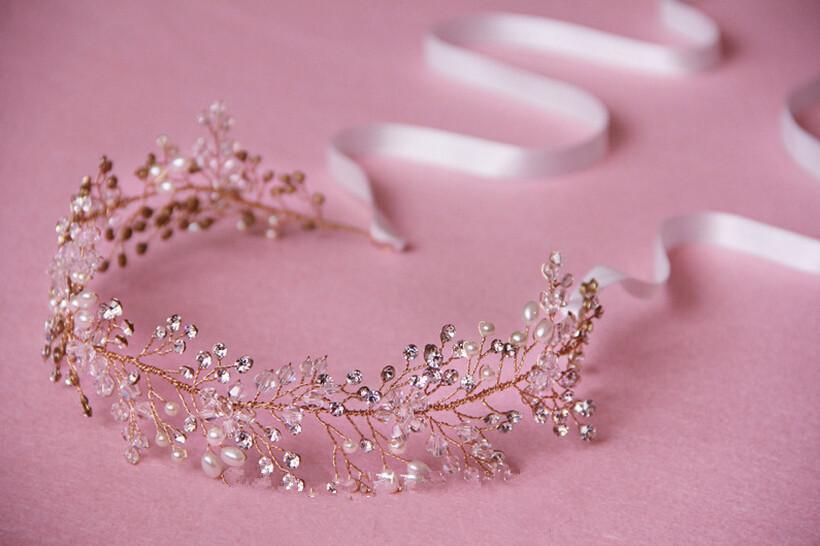 Delicate silver crystal bridal hair accessory featuring a pure handmade gold rose gold headpiece adorned with sparkling crystals and freshwater pearls in an elegant leafy pattern.
