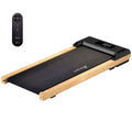 Black and light wood-framed compact wood walking pad with shock-absorbing belt and digital display with remote control