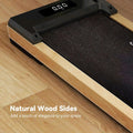 Black 2.5hp wood walking pad treadmill with natural wood sides, shock-absorbing belt, remote control, and wheels