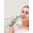 Mint green handheld 2 in 1 nasal aspirator baby and blackhead remover with metallic nozzle and digital display