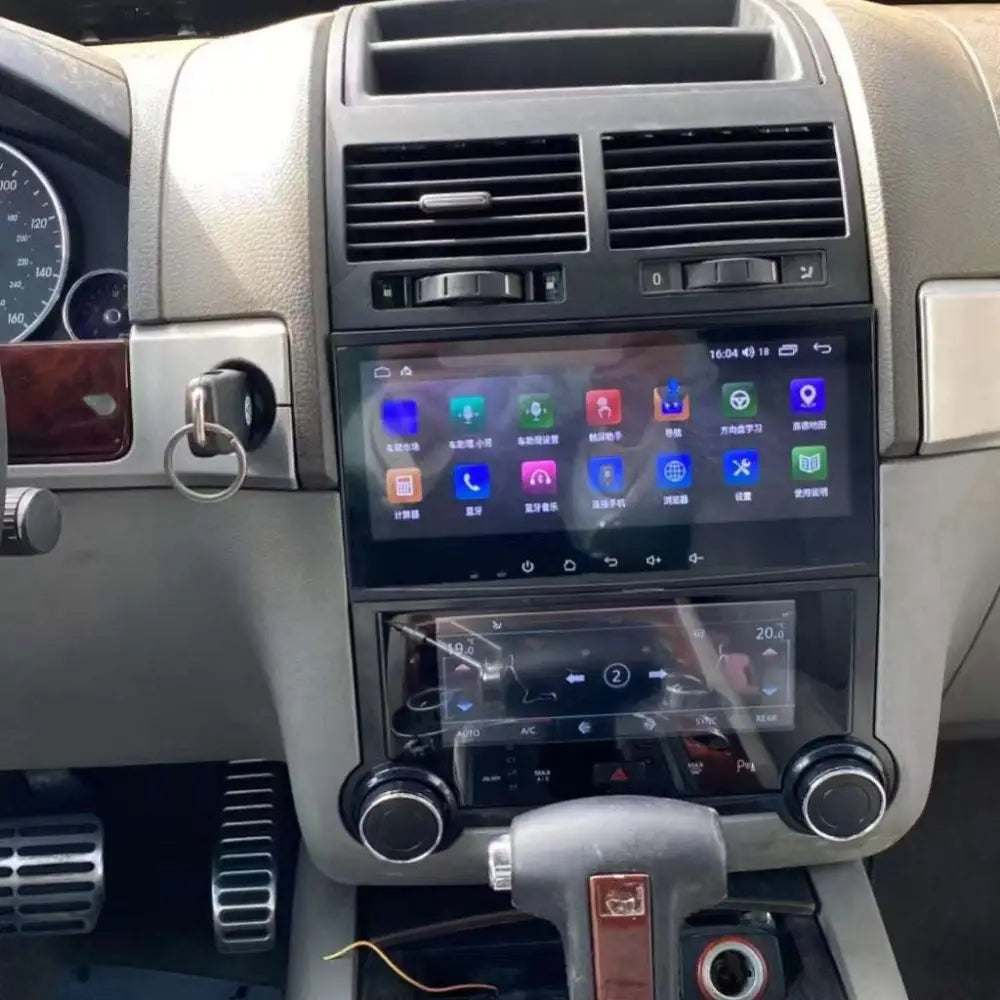 Black touareg android smart touchscreen car stereo with silver trim and dual display screens for navigation and media
