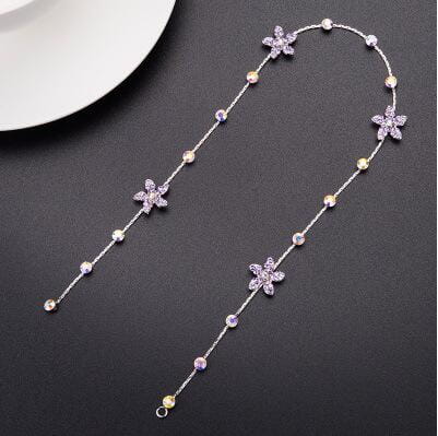 a delicate silver chain necklace with sparkling star-shaped charms and small round beads in gold white and iridescent hues as part of beaded pink floral wedding hair accessories for elegant wedding hair use.