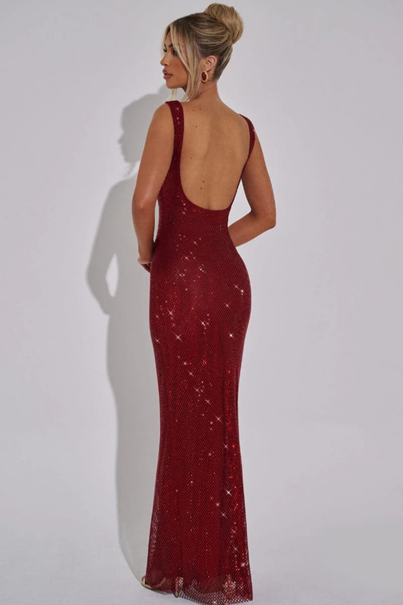 a shimmering burgundy fitted gown featuring silver strap sequins net with an open back showcasing the net drill suspenders design