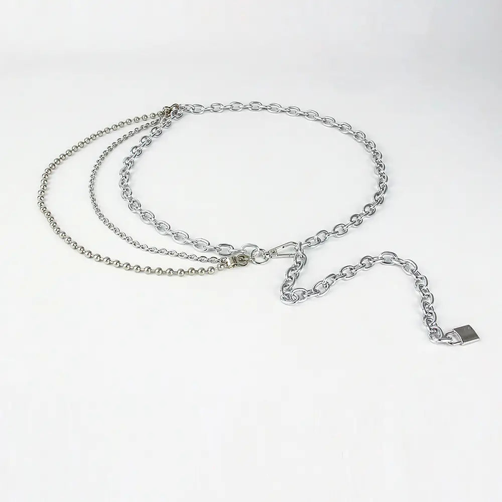 Silver-toned chain belt summer body jewelry with layered interlocking links and a small padlock charm, ideal as body jewelry hip or jewelry hip hop accessory.