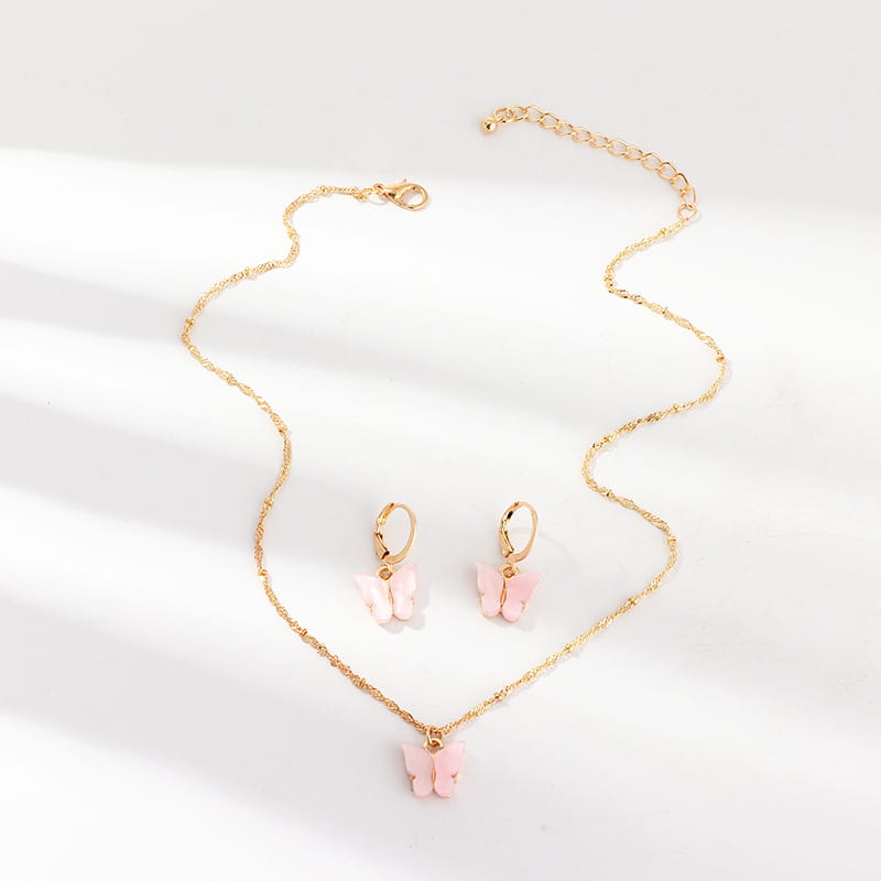 Fashion resin butterfly necklace and earring set featuring a gold chain with a pink resin butterfly pendant and matching gold hoop earrings.