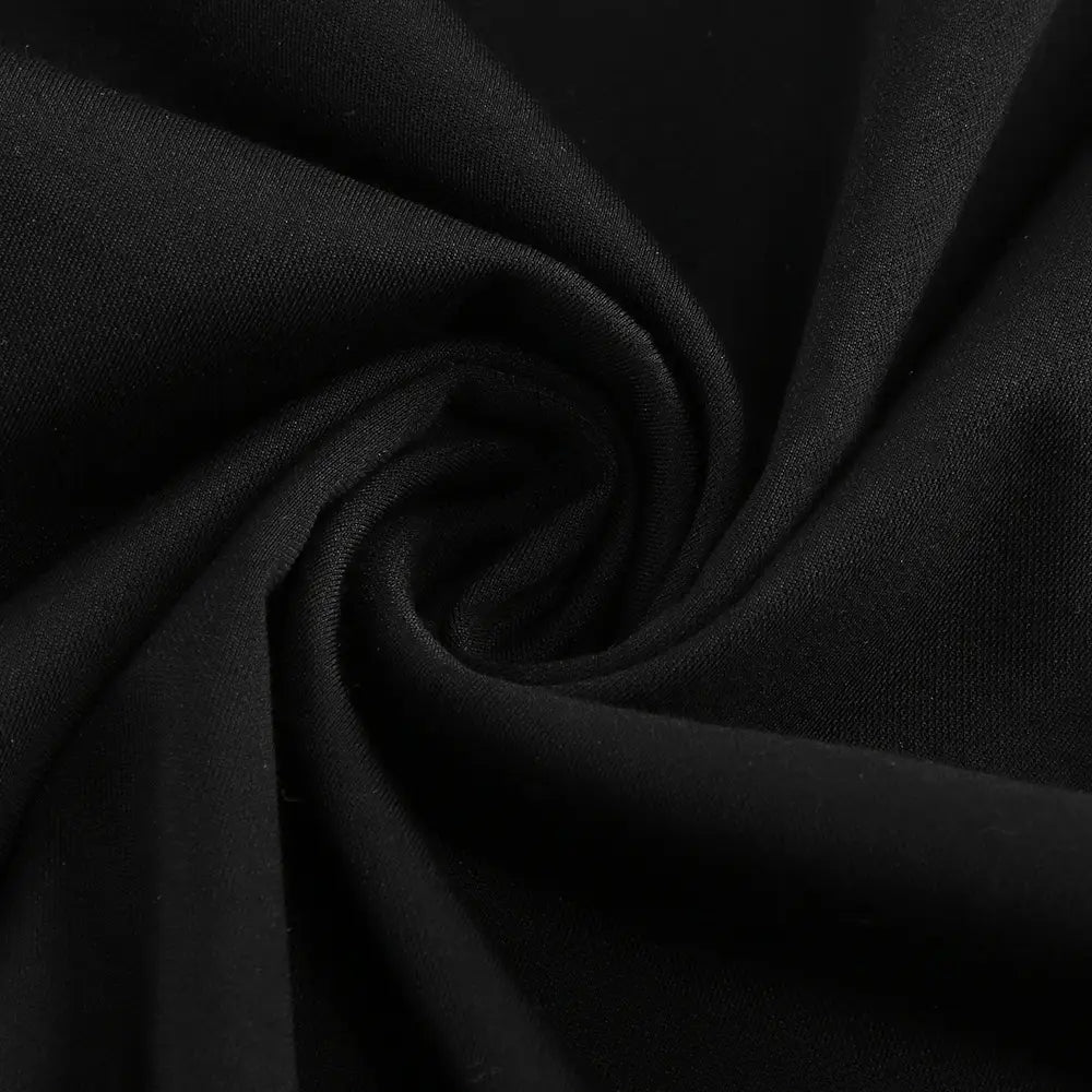 black backless long sleeves gown made of smooth textured fabric with a subtle sheen and soft drape at the skirt waist