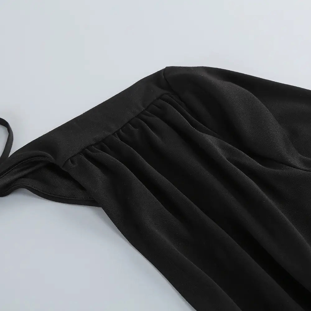 black satin backless long sleeves gown with gathered waistband and thin straps featuring a long sleeves skirt waist design