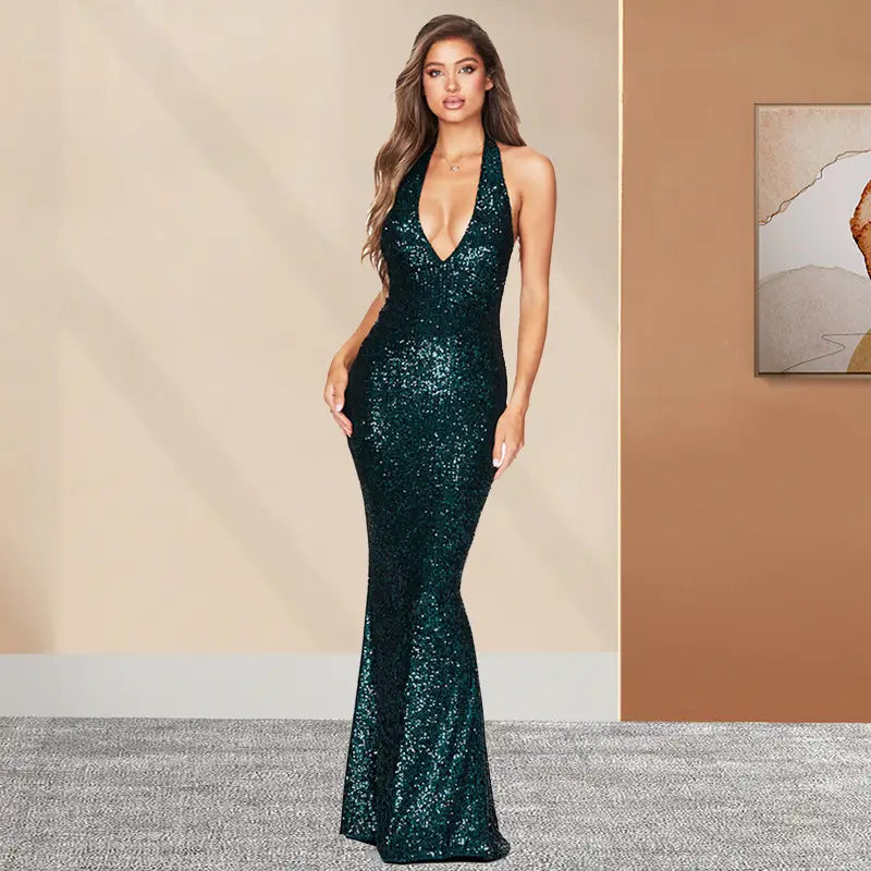 A shimmering emerald green sequined mermaid-style halter backless dress with a deep v halter neckline ideal for american skirt summer fashion.