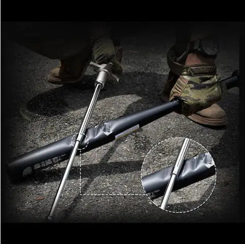 Black telescopic self-defense anti-cut stick with a silver metallic tip and textured grip designed for durability and concealment by Royale Essence Lux.