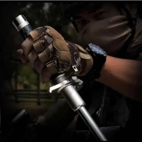 A telescopic self-defense anti-cut stick featuring a metallic silver tactical flashlight with a black textured grip held firmly in a rugged combat glove by Royale Essence Lux.