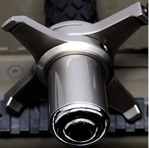 shiny chrome bicycle hub with a sleek multi-spoke design and black tire tread visible above featured on the back side of the telescopic self-defense anti-cut stick by royale essence lux