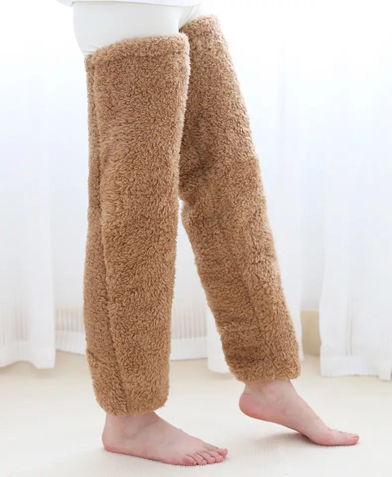 tan paw print fuzzy long socks made of plush faux fur leg warmers worn over pants