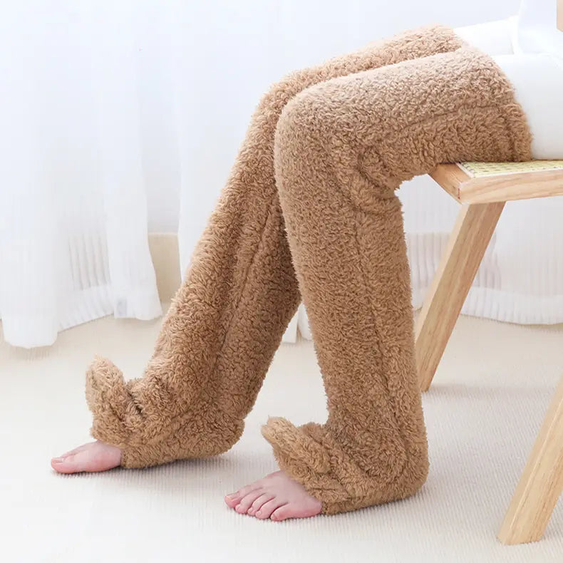 tan plush fleece leg warmers with soft textured surface and ribbed cuffs designed as fuzzy long socks for cozy wear