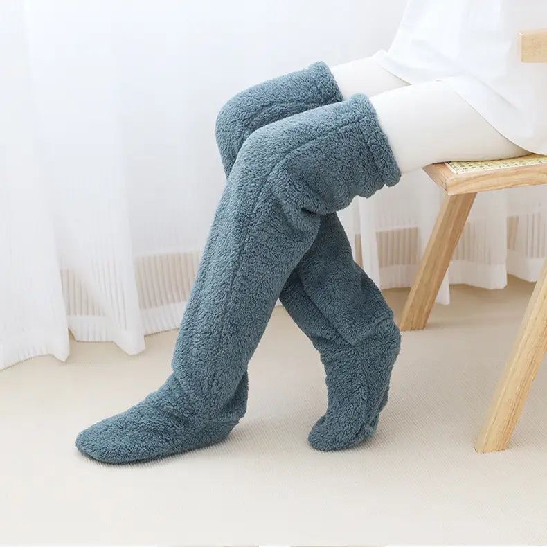 soft teal-colored fleece fuzzy long socks with a plush textured surface and snug fit from tan paw print fuzzy long socks collection