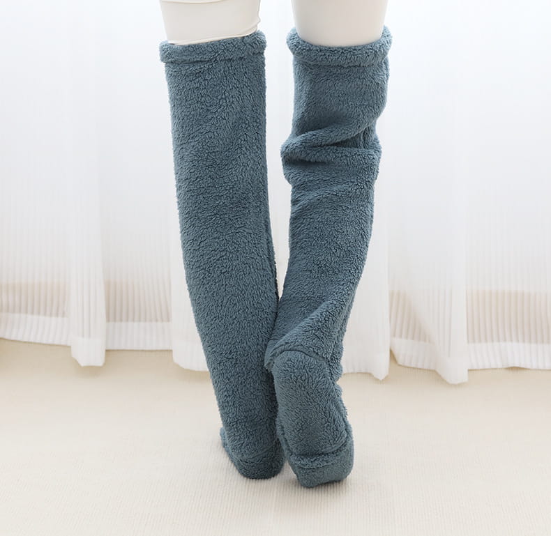 soft teal-colored fleece fuzzy long socks with a plush texture and snug fit from the tan paw print fuzzy long socks collection