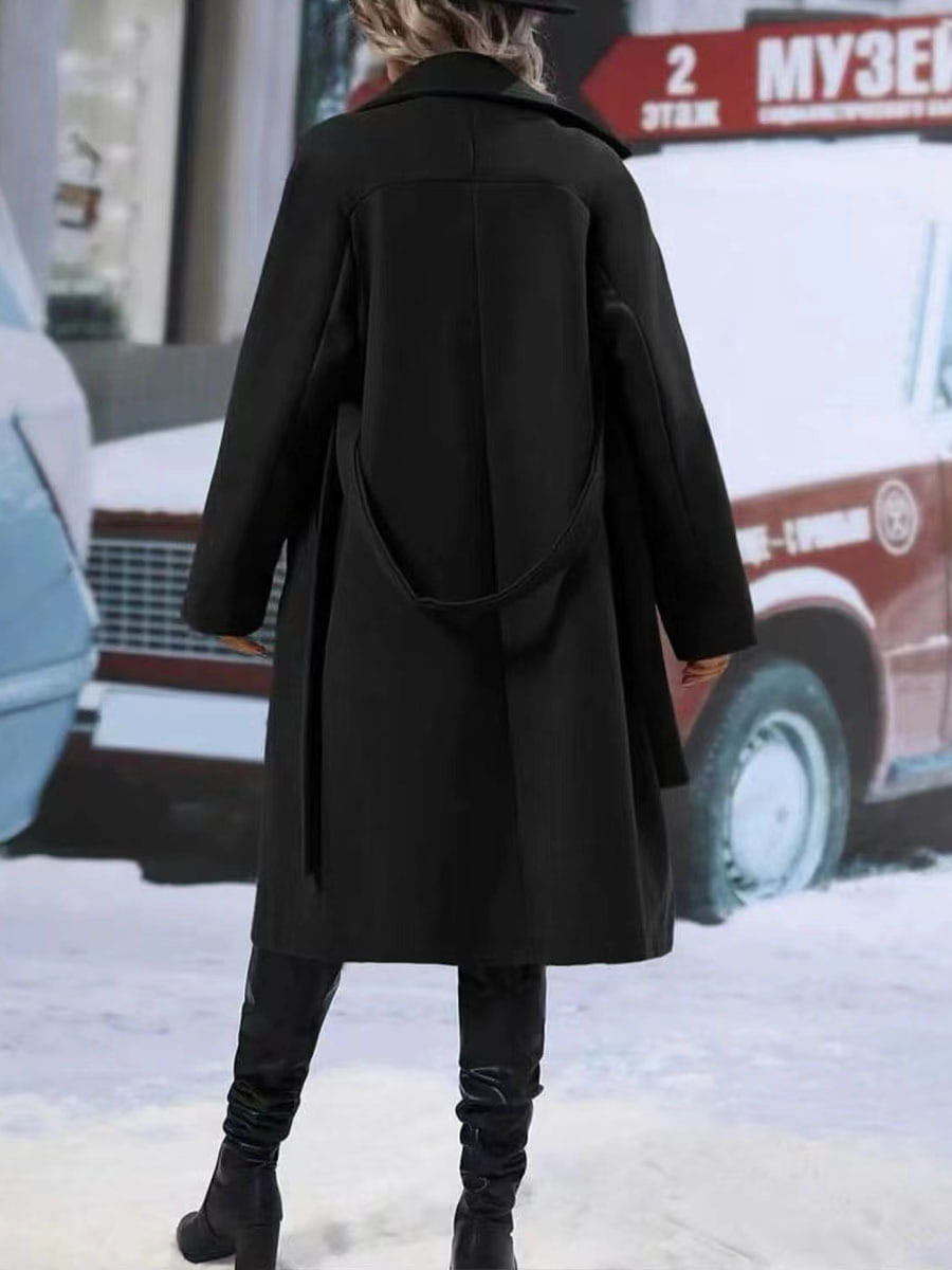 black wool coat with a belted back and classic collar showcasing belt winter fashion in a solid color winter fashion design