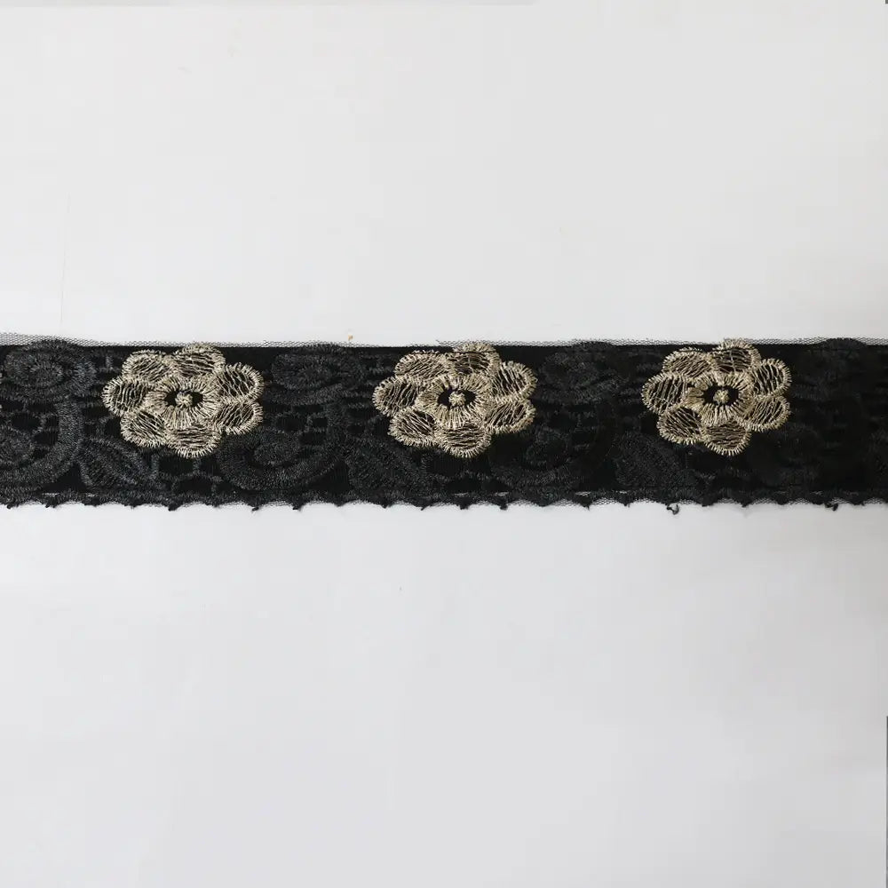 black lace trim with three embroidered gold toned floral motifs on the teal gold embroidered vest dress kraft abaya with kraft tan dress detailing