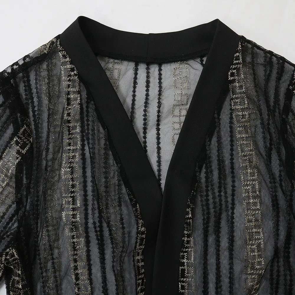 black sheer overlay top with intricate silver geometric embroidery and solid black collar as part of the teal gold embroidered vest dress kraft abaya in vest dress kraft style