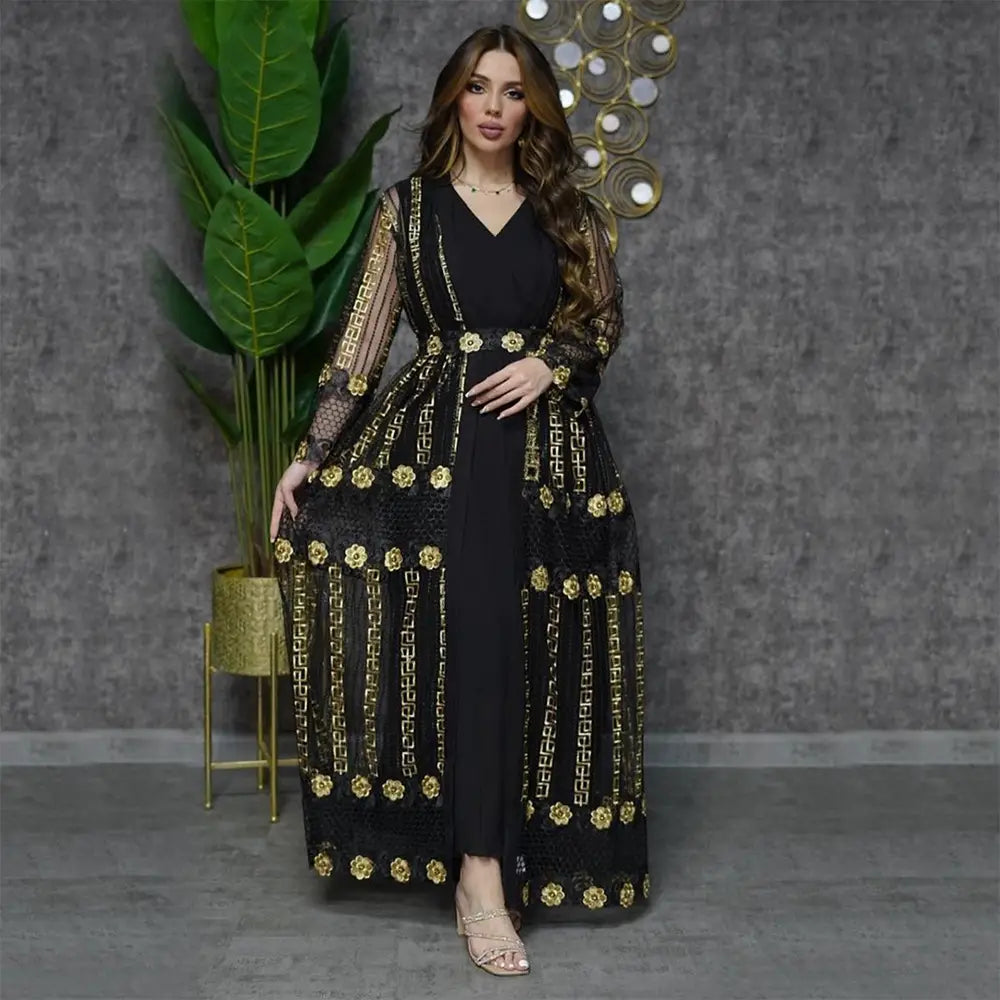 Elegant black vest dress kraft with gold geometric and floral embroidery, sheer long sleeves, and v-neckline in the teal gold embroidered vest dress kraft abaya collection.