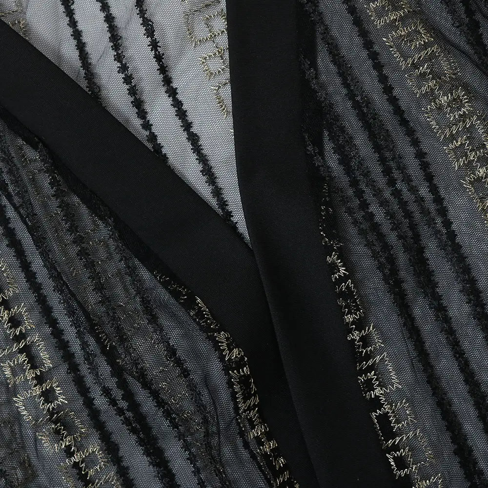 black and silver embroidered sheer fabric with satin lining in a vest dress kraft tan style for elegant occasion wear