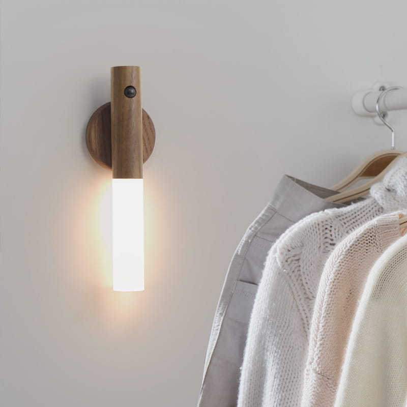 A sleek wooden led desk lamp sconce with a minimalist design featuring a natural wood finish and frosted glass diffuser mounted on the wall.