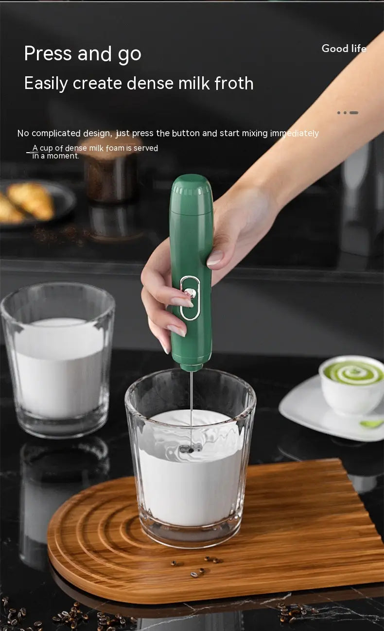 green handheld battery version milk frother with a sleek ergonomic design and a single button for easy operation