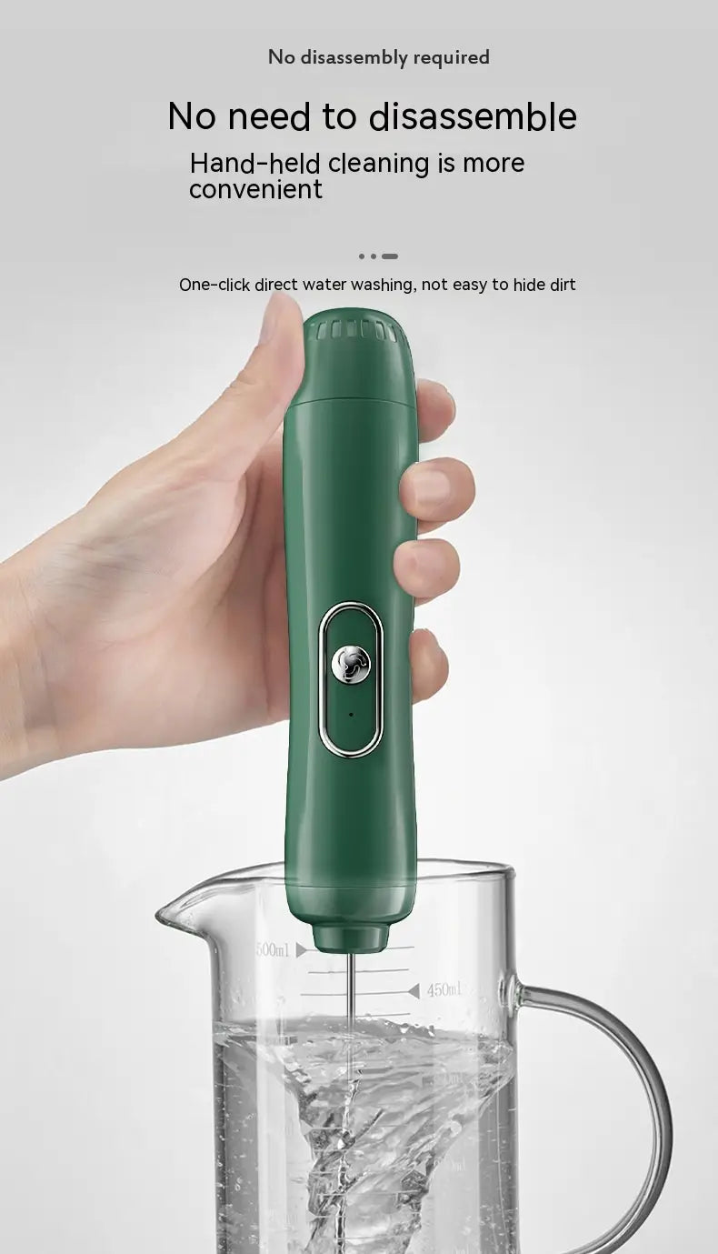 green handheld battery version milk frother with a sleek cylindrical design and a silver button for easy use