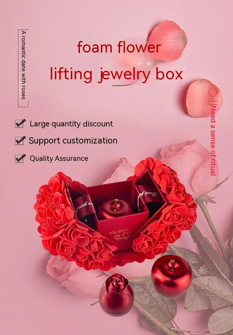 Red foam rose-shaped lifting gift box with heart design and glossy red spherical accents for crystal pendant necklace packaging.