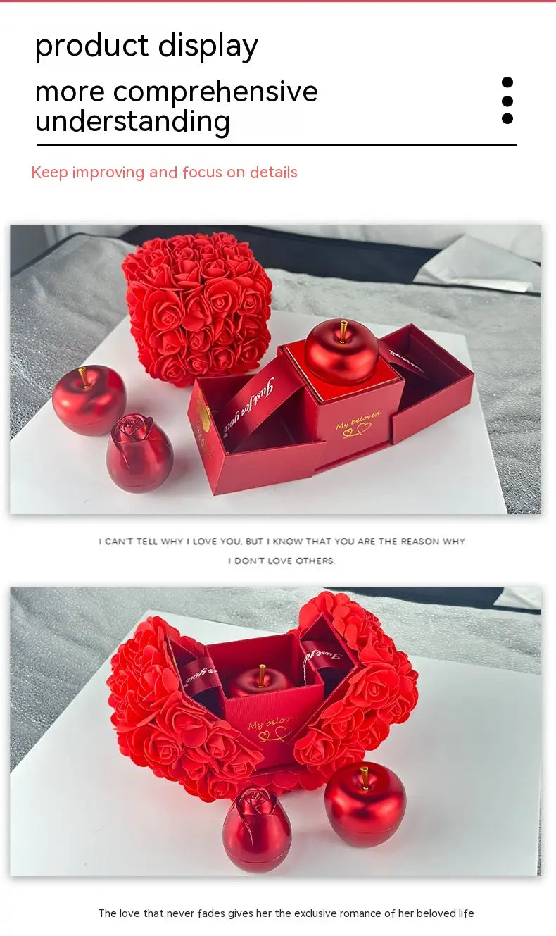Red rose bouquet gift set with matching red apple-shaped ornaments and decorative box featuring a crystal pendant necklace displayed in an elegant gift box.