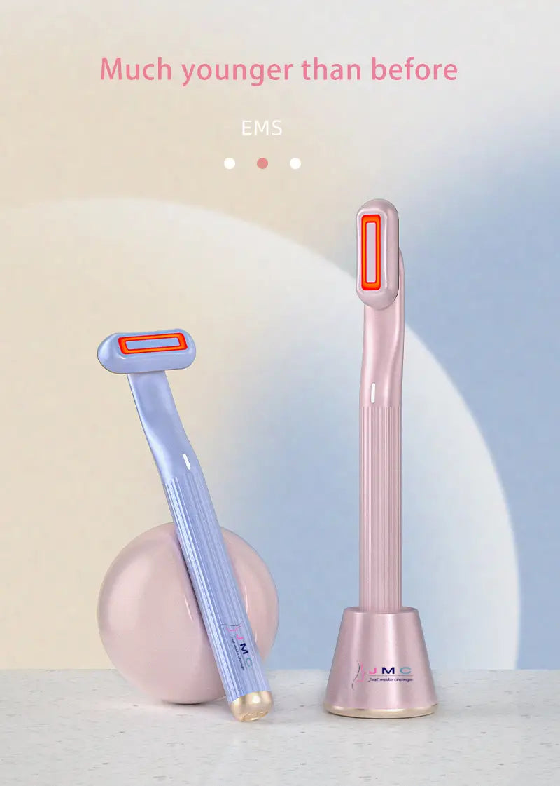 pink and light blue 5-in-1 360 degrees rotary eye massage wands with orange-accented heads and sleek metallic finishes designed for therapeutic warmth and facial treatment use.