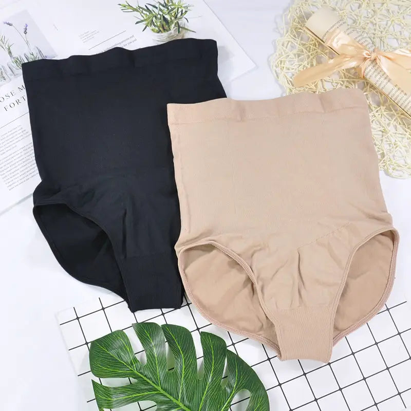 A pair of high waisted lace ladies triangle seamless bodysuit panties in black and beige featuring a seamless waist design.