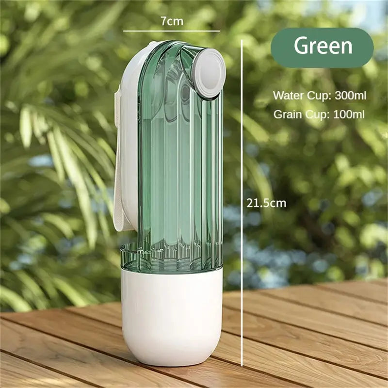 Portable green and white dual-compartment pet water cup with a sleek translucent design for dog walking in the water cup segment.